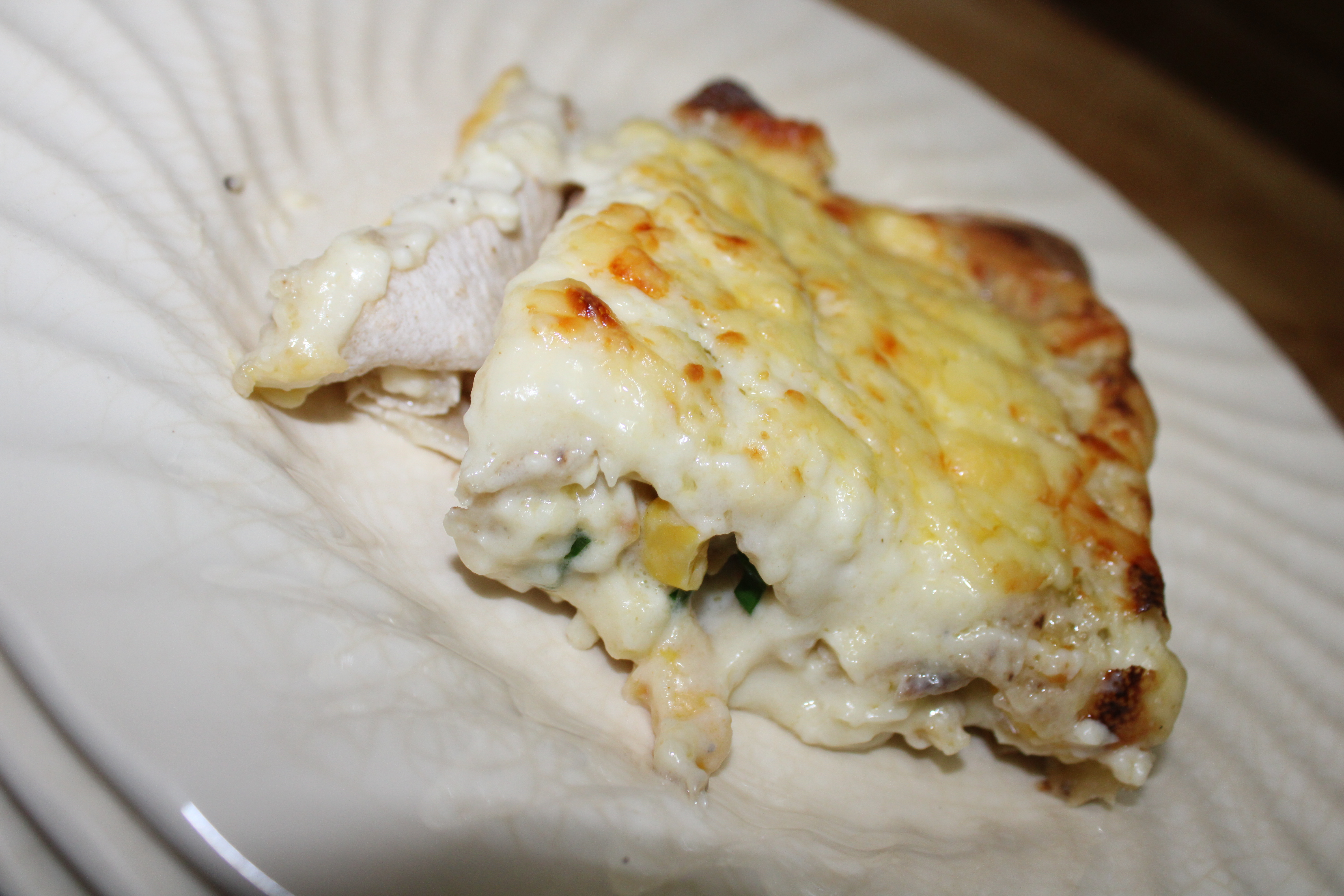 White Chicken Enchilada on a plate